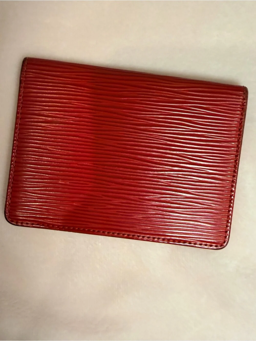 Signature Louis Vuitton textured Epi leather slim wallet